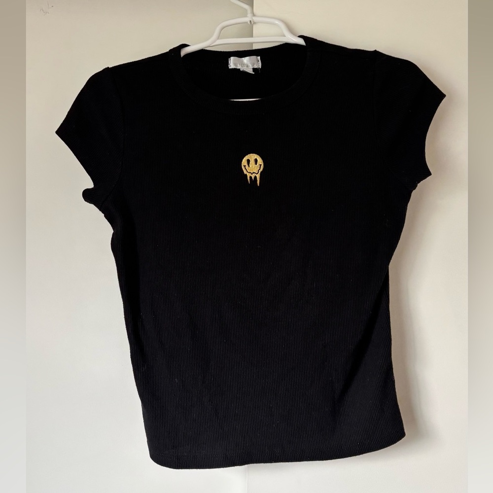 Black ribbed top with embroidered dripping smiley face